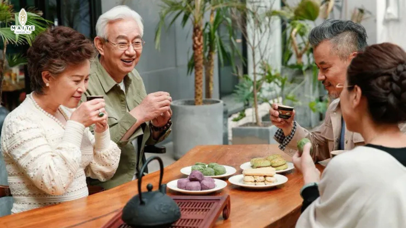 People happily gathering over tea illustrates the cultural beauty of connecting people and spreading warmth through everyday shared moments.